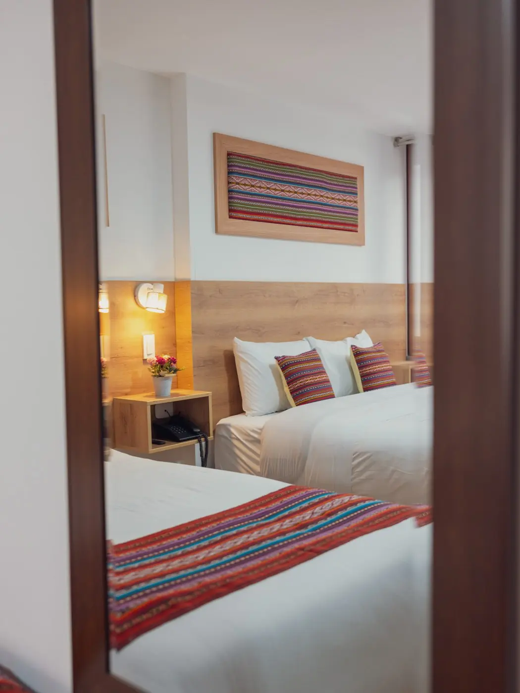 An Ayni room framed by a wooden doorway