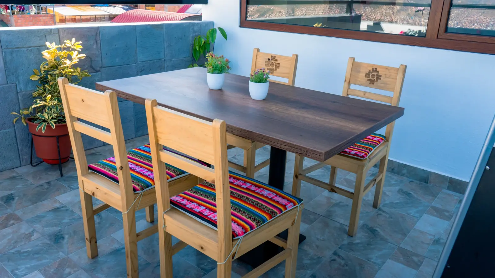 Table and chairs beside the window