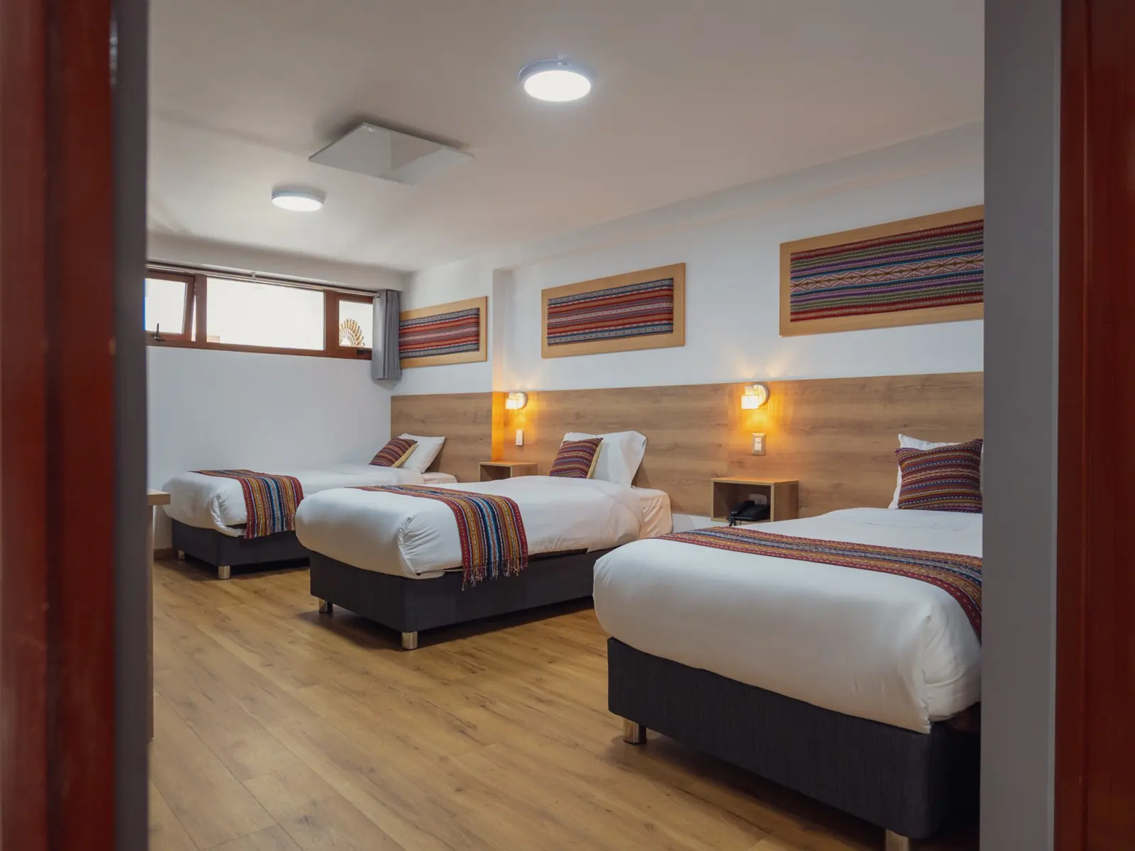Room with three separate beds