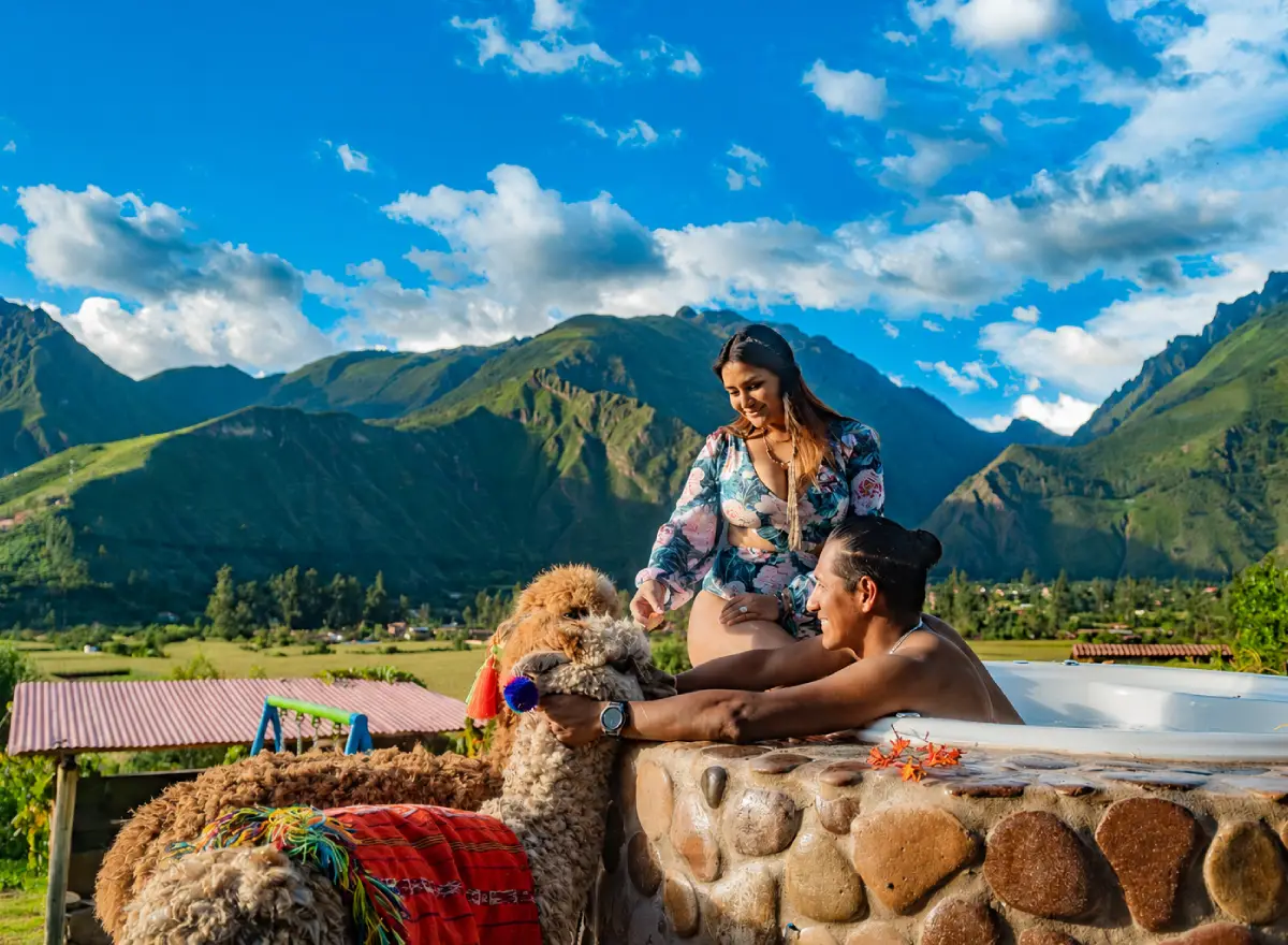 Couple relaxing at a hotel for couples in Cusco with a private atmosphere, outdoor hot tub, and peaceful view.
