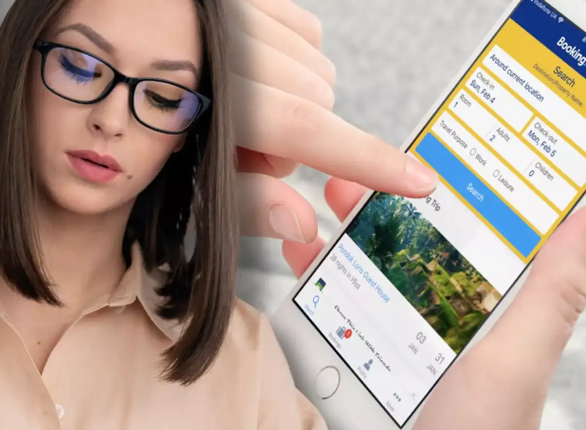 Traveler searching for a hotel on a booking platform from a phone, reviewing dates, rooms, and location before choosing.